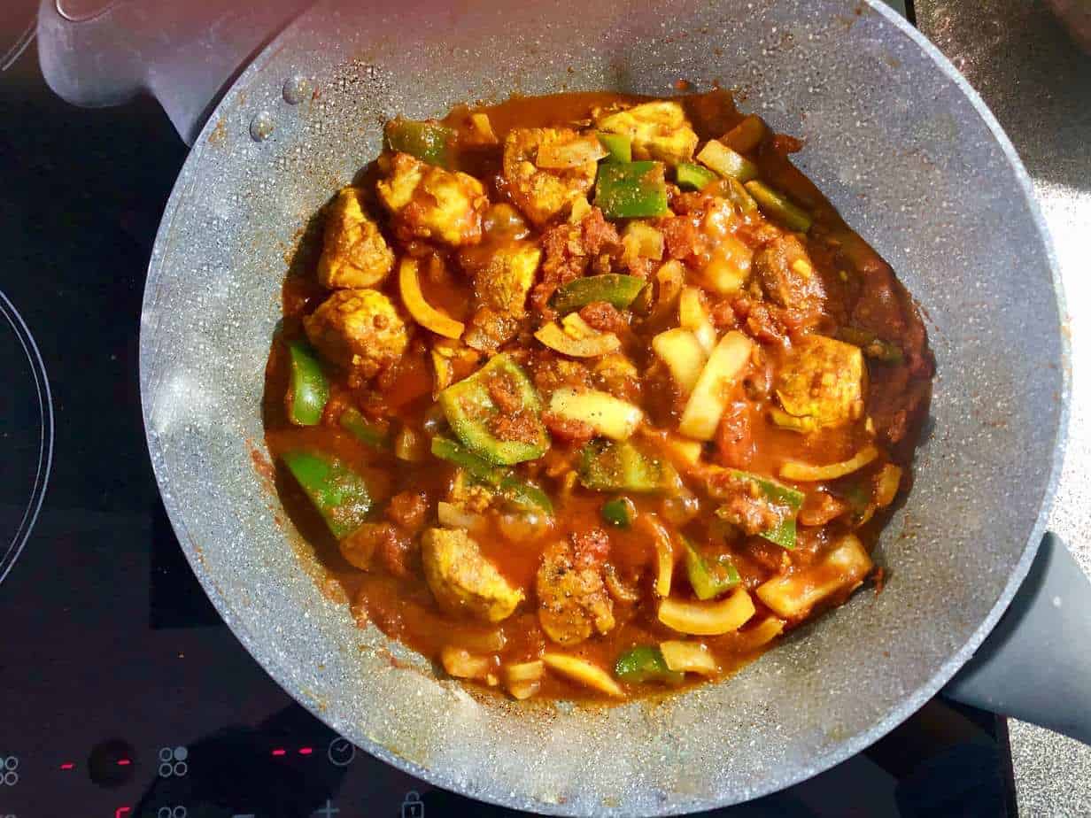 Chicken jalfrezi cooking in a pan