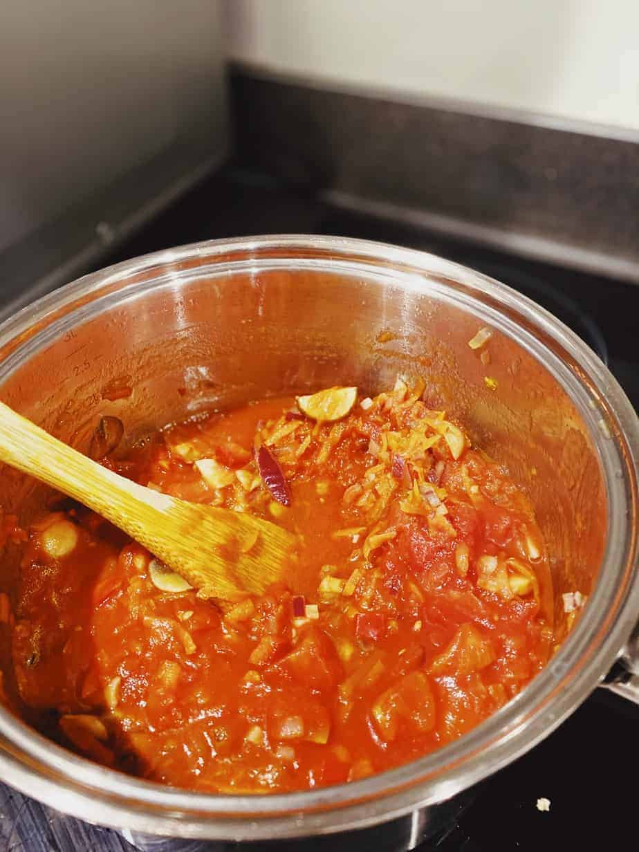 Tomato pasta sauce cooking in saucepan