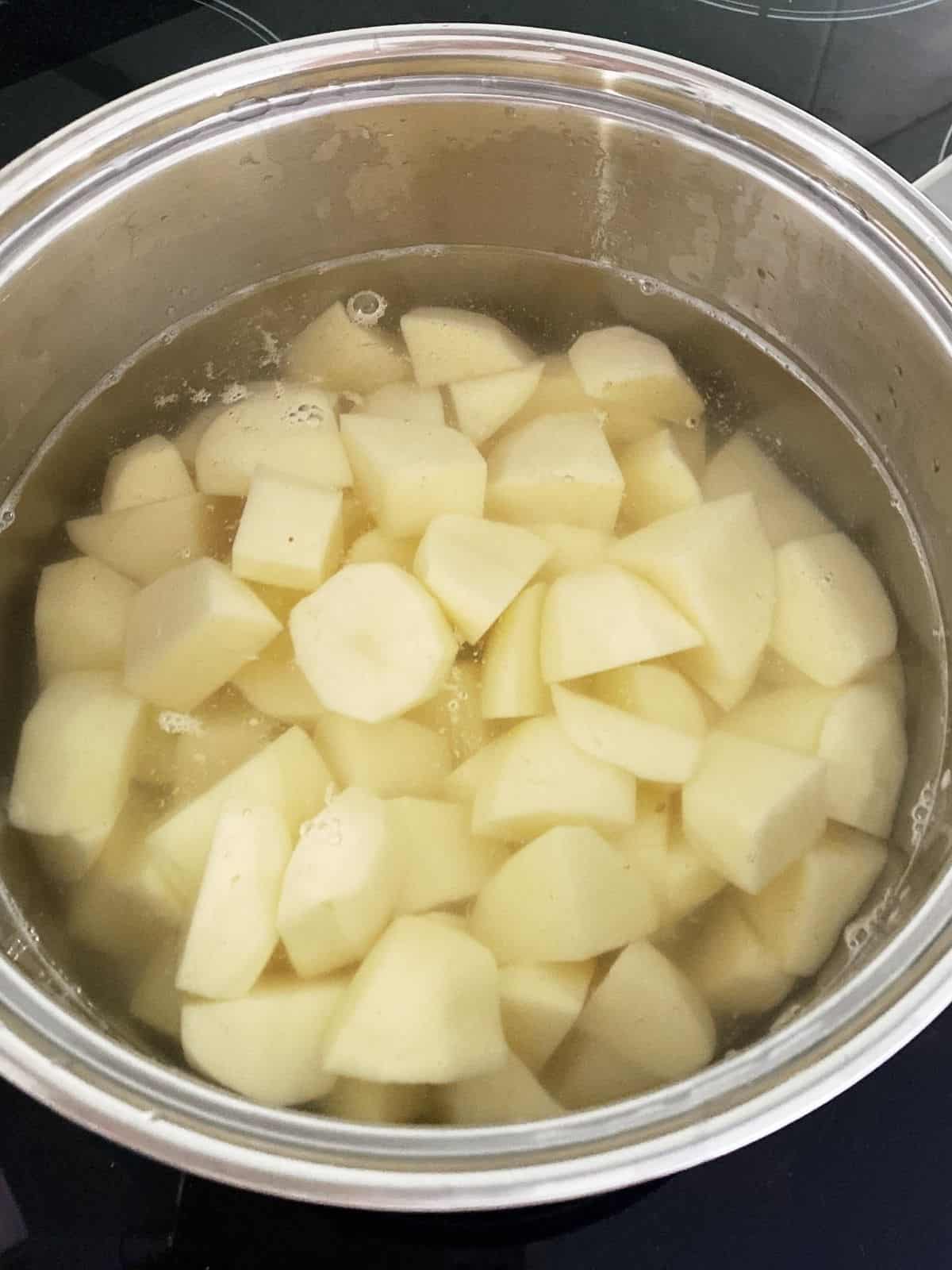 potatoes in a saucepan ready to mash