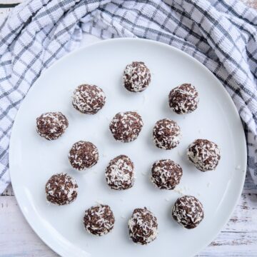 date energy balls on a white plate