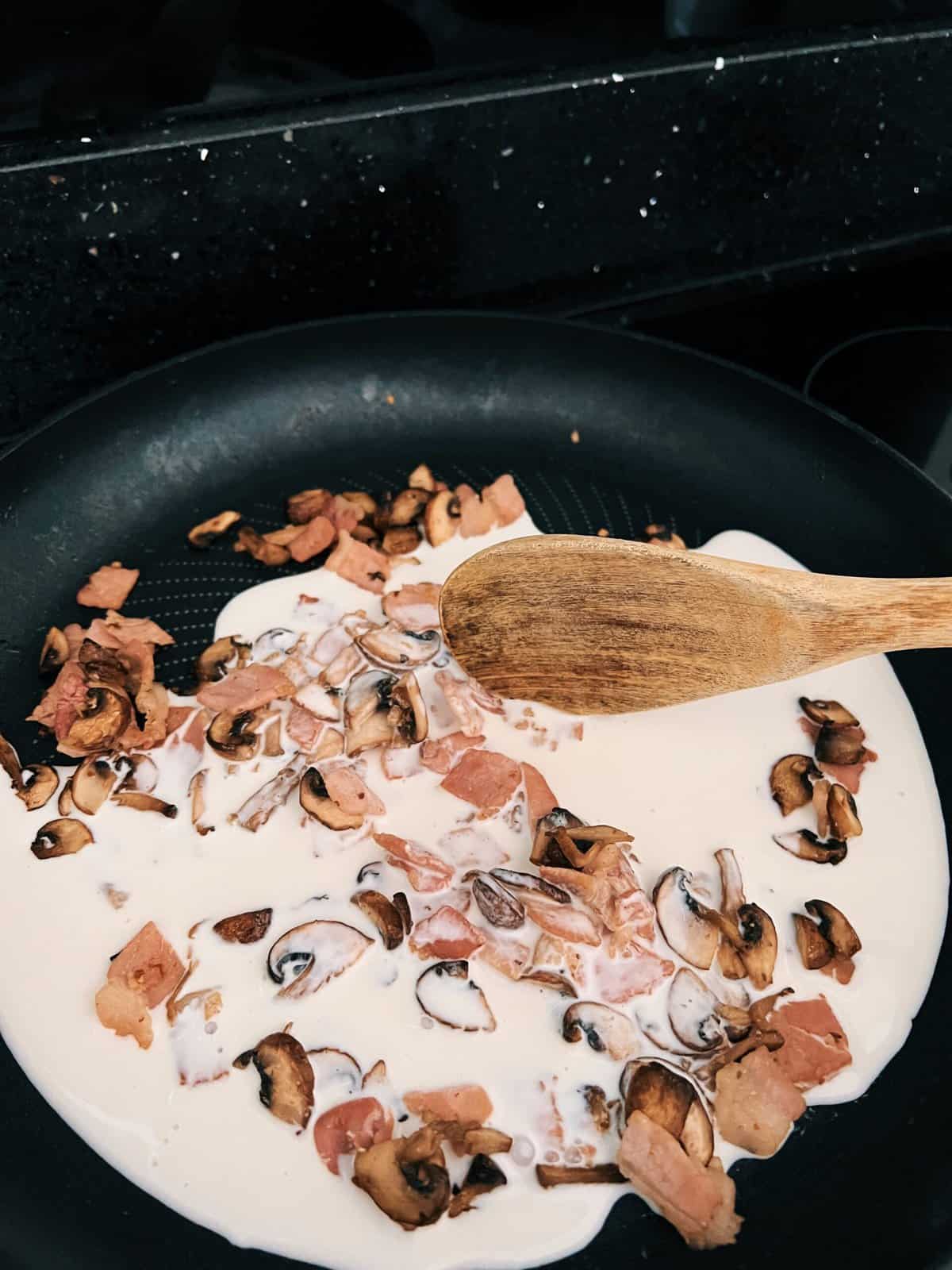 oatly cream bacon and mushroom in a frying pan