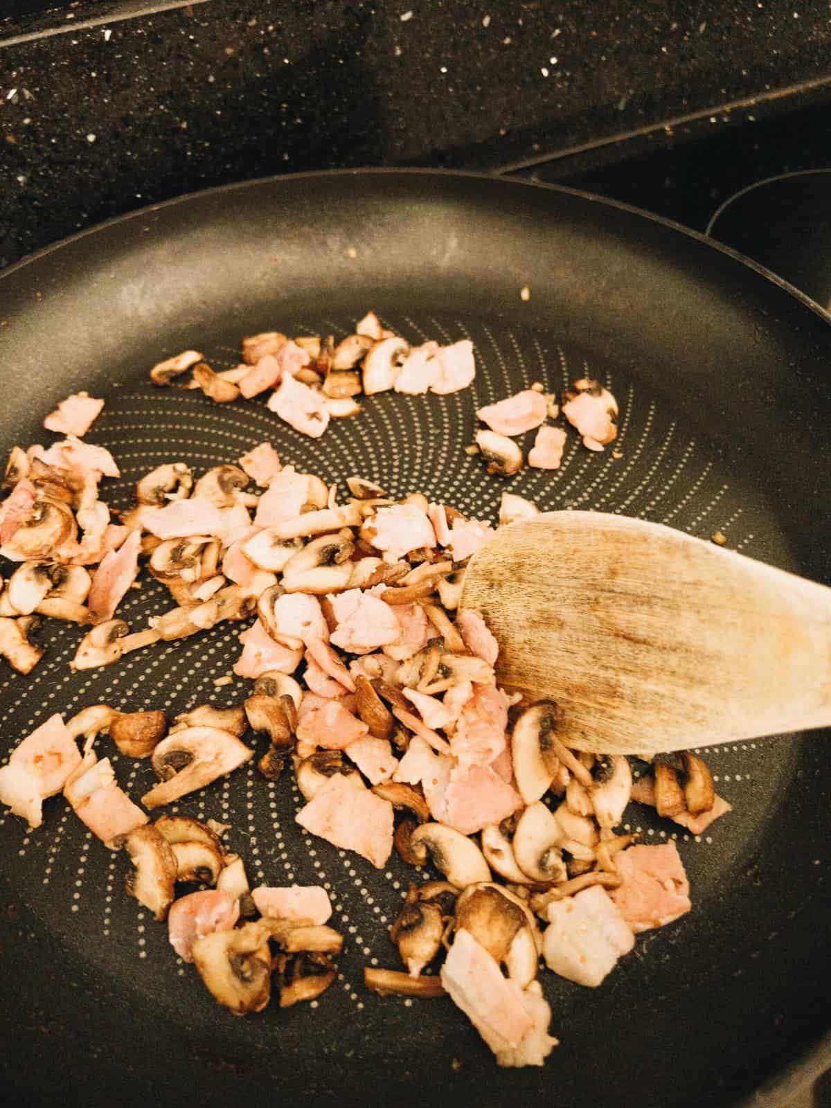 bacon and mushroom in a frying pan