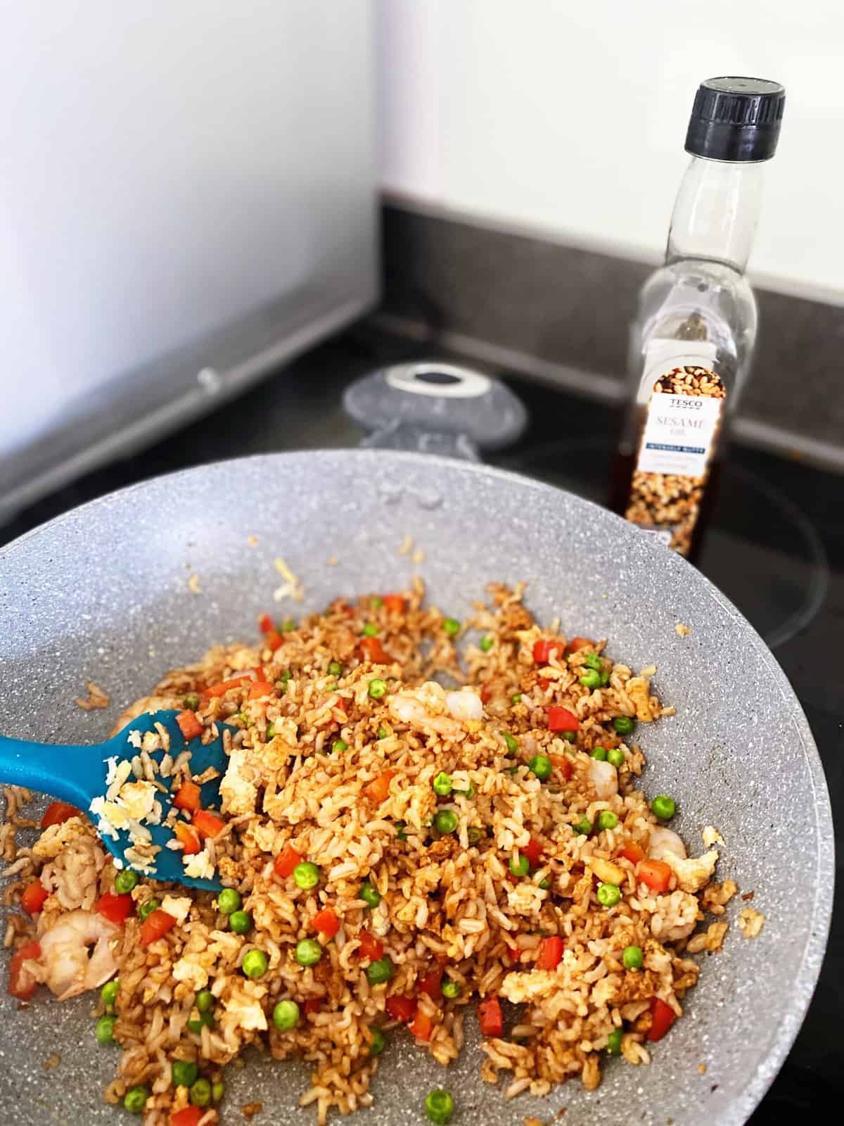 fried rice frying in a pan