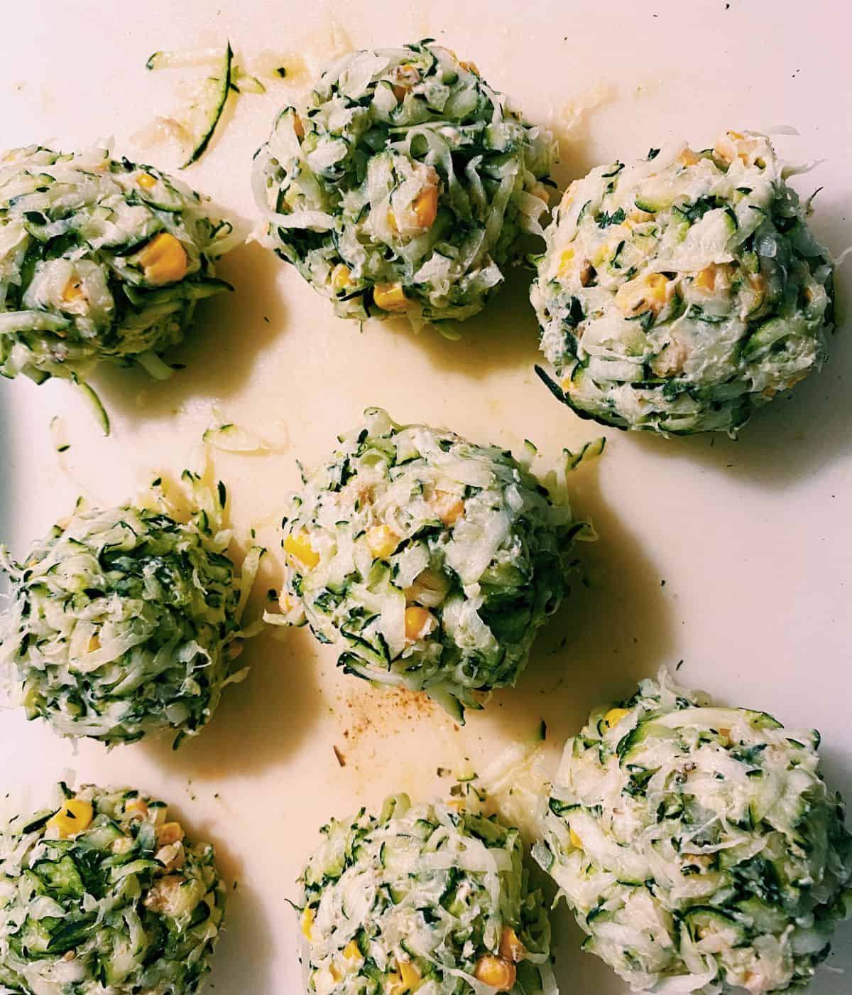 sweetcorn and courgette fritters rolled into balls before they are cooked