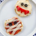 mini pizzas with strips of cheese laid over and black olive eyes to make them look like ghosts and mummies.