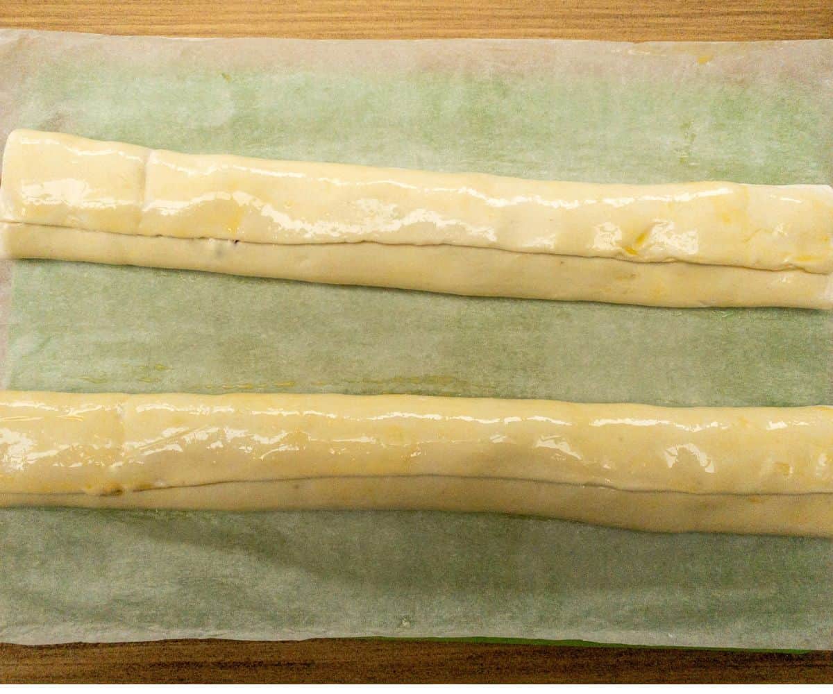 puff pastry filled with sausage meat and rolled ready to cut.