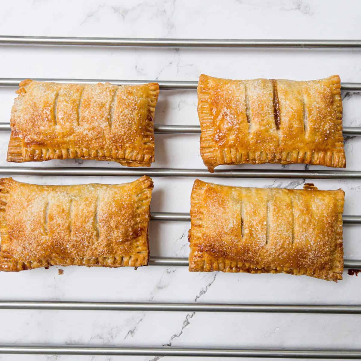 https://thescattymum.com/wp-content/uploads/2023/03/gluten-free-apple-turnovers-cooling.jpg
