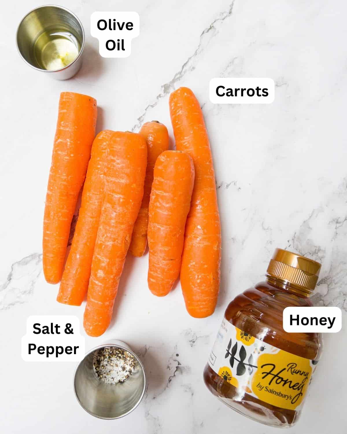 Ingredients laid out for honey roasted carrots.