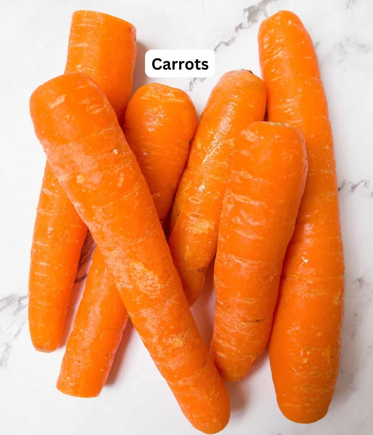 6 carrots piled on top of each other.