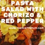Bow pasta with chunks of red pepper, chorizo & red onion in a square white bowl.