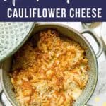 Cauliflower cheese in a casserole dish, with a small bowl of cheese on the side.