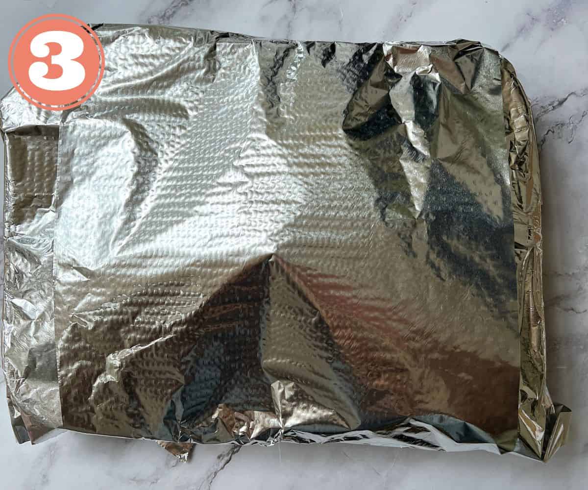 A roasting tin wrapped in aluminium foil.