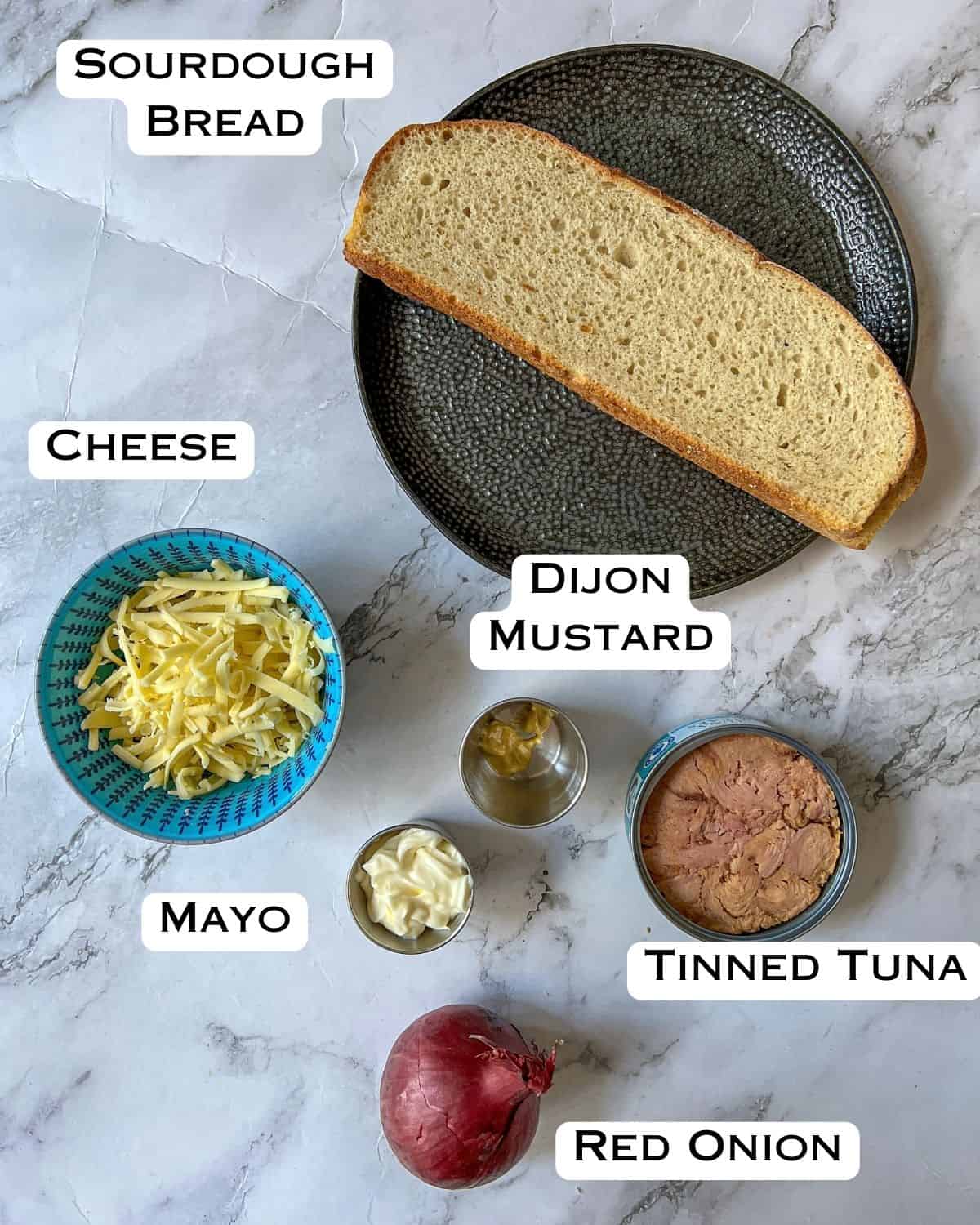 Ingredients laid out for a tuna melt sandwich.
