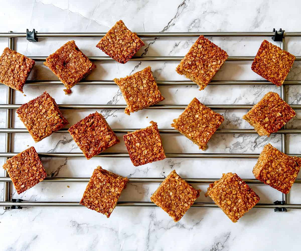 Flapjack squares laid out on a cooling rack.