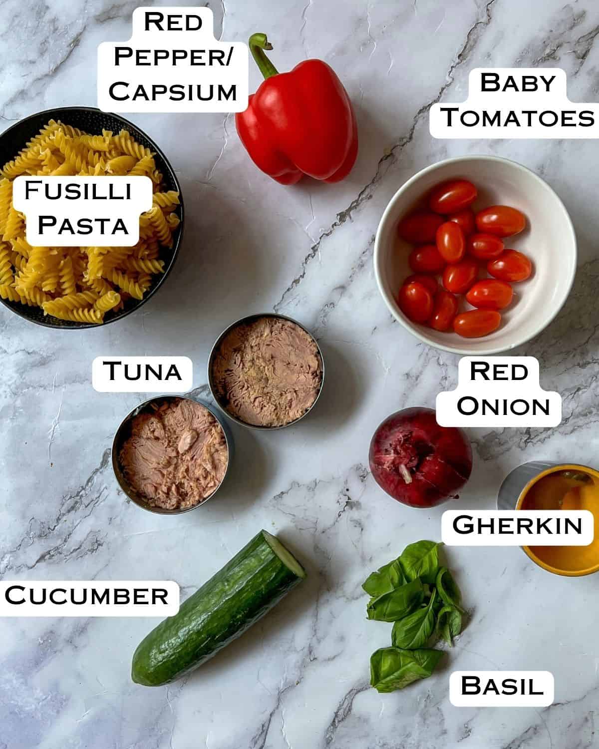 Ingredients laid out for tuna pasta salad.