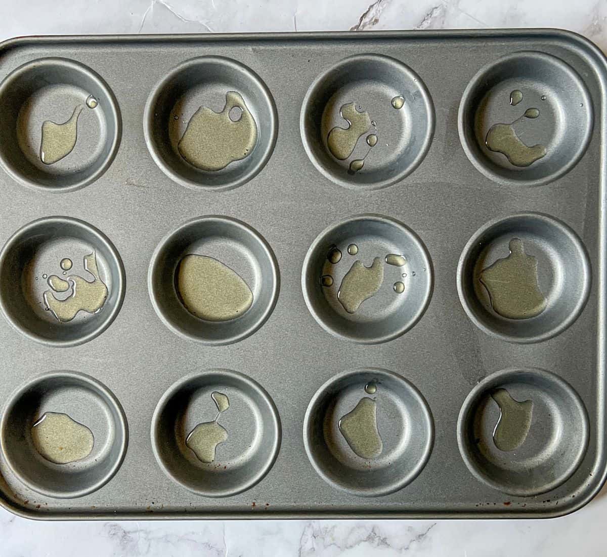Oil in a 12 hole cupcake tray.