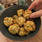 Someone picking a stuffing ball out of a bowl.