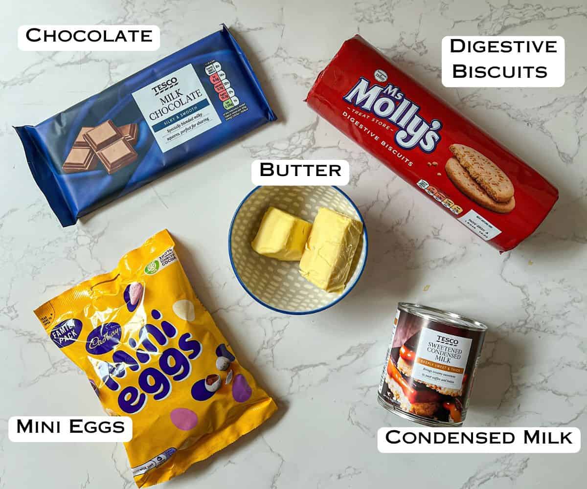 Ingredients laid out to make no bake mini egg chocolate slices.