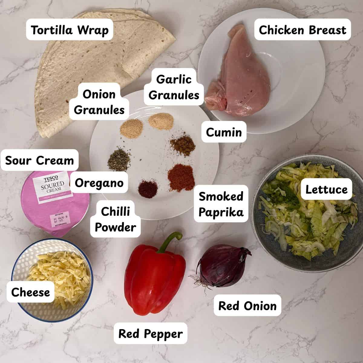 Ingredients laid out for a chicken fajita wrap.