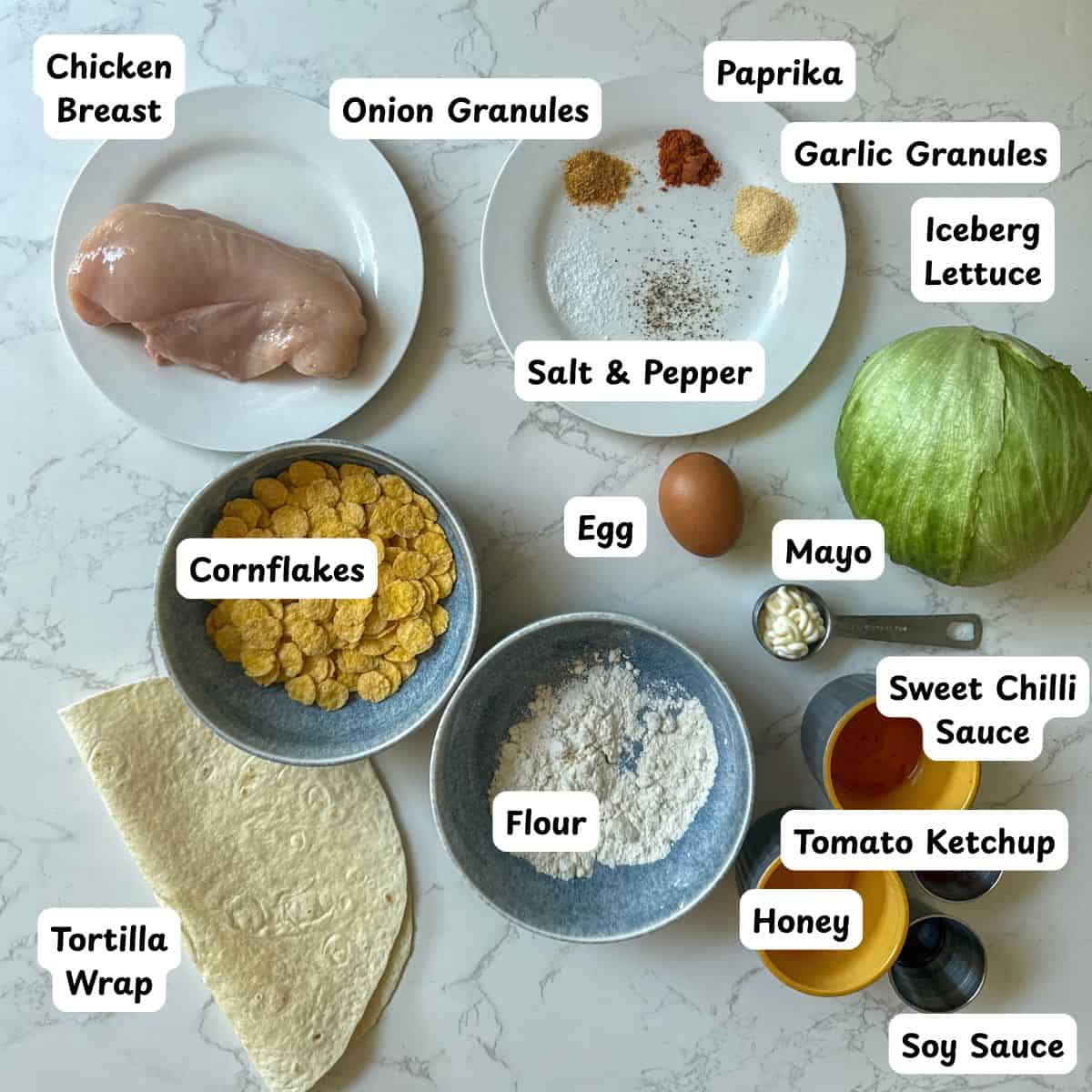 Ingredients laid out to make sweet chilli crispy chicken wraps.