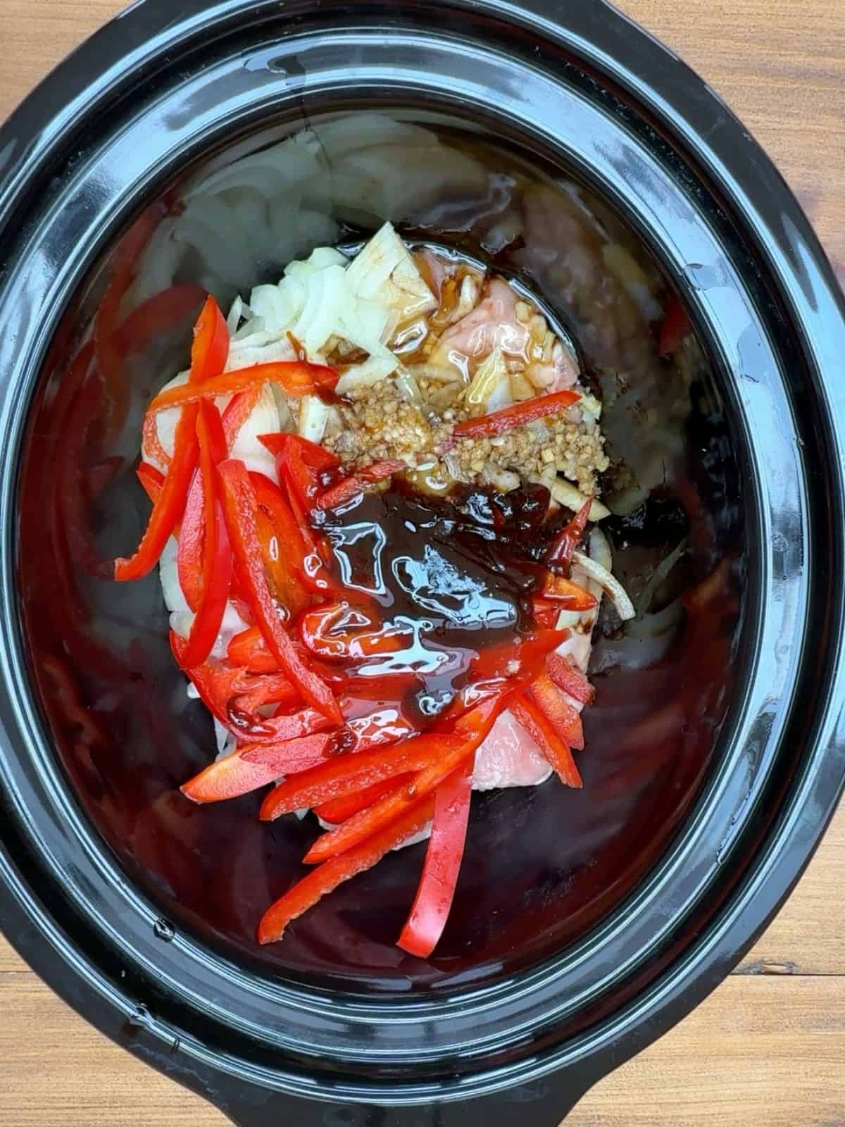 Red pepper onions & hoi sin sauce in a slow cooker.