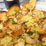 Garlic bread with cheese topped pasta bake.